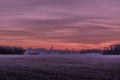 Beautiful purple sunset over the field Royalty Free Stock Photo