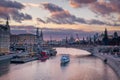 Beautiful purple sunset over Moskva river and a touristic boat