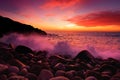 Purple tinted waves breaking on a rocky beach at sunset over Porth Nanven in the Cot Valley of Cornwall, England