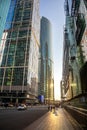 A beautiful quarter of high glass skyscrapers. The sun reflects off the buildings.