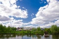 Beautiful quiet lake with a wooden gazebo in a rural cottage village. Country holiday Royalty Free Stock Photo