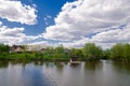 Beautiful quiet lake with a wooden gazebo in a rural cottage village. Country holiday Royalty Free Stock Photo