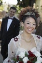 Beautiful Quinceanera Holding Bunch Of Roses