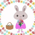 Beautiful rabbit rabbit gray with flowers in the paws