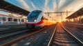 Beautiful railway station with modern high speed commuter train with motion blur effect with sunset Royalty Free Stock Photo