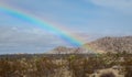 A Beautiful Rainbow Beams Down on the Desert Near the Entrance to Joshua Tree National Park in Southern California