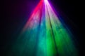 Beautiful rainbow color wide lens projector with light beam for movie and cinema at night . smoke texture spotlight , screening