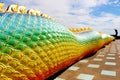 Beautiful Rainbow colors of Praya Nark or Naga in Thai temple with colorful sky and sun flare effect on sunrise time Royalty Free Stock Photo