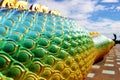 Beautiful Rainbow colors of Praya Nark or Naga in Thai temple with colorful sky and sun flare effect on sunrise time Royalty Free Stock Photo