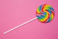 Beautiful rainbow lollipop on a pink background Royalty Free Stock Photo