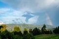 Beautiful rainbow in a lush green nature landscape in south america