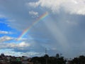 A beautiful rainbow in the middle of the city right after a big summer storm