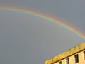 A beautiful rainbow over a city just after a big storm Royalty Free Stock Photo