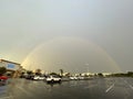 Beautiful rainbow over empty parking lot Royalty Free Stock Photo