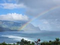 Beautiful rainbow over Hanalei Bay in Kauai Hawaii with cliffs and cloudscape in the background Royalty Free Stock Photo