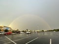 Beautiful rainbow over empty parking lot Royalty Free Stock Photo