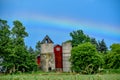Rainbow over Red Barn with Silos Royalty Free Stock Photo