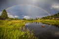 Rainbow Over River In Russian Village Royalty Free Stock Photo