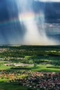 Beautiful rainbow with rainy clouds, colorful summer view