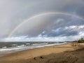 Beautiful rainbow seen after rain at beautiful beach