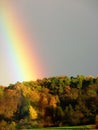 Beautiful rainbow spans colorful autumn forest 1 Royalty Free Stock Photo