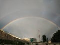 Beautiful rainbows on the sky after rain in mountains area.