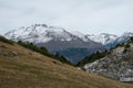 Beautiful range of high rocky mountains covered with snow during daytime