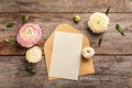 Beautiful ranunculus flowers with envelope Royalty Free Stock Photo