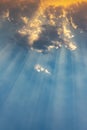 Beautiful ray of sunlight breaking through clouds at sunset Royalty Free Stock Photo