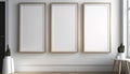 Three vertical white blank frames hanging on wall. Modern wooden office interior. Generative AI Royalty Free Stock Photo