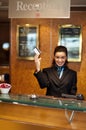 Beautiful receptionist posing with cash card