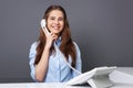 Beautiful receptionist talking on the phone Royalty Free Stock Photo