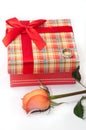 Beautiful red box with red bow, orange rose and engagement ring Royalty Free Stock Photo