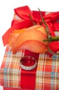 Beautiful red box with red bow, orange rose and engagement ring Royalty Free Stock Photo