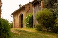 Beautiful red brick village house in Italy surrounded by plants and flowers. Royalty Free Stock Photo