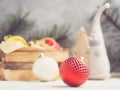 Beautiful red Christmas ball on bright holiday background