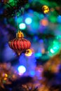 Beautiful red Christmas ball decoration hanged up on a Christmas tree with nice blurry background Royalty Free Stock Photo