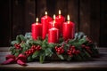 Beautiful red Christmas candles illuminate advent wreath with vibrant berries and festive ribbon