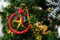 Beautiful red curtain ring ornament on Christmas tree Royalty Free Stock Photo