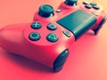 Beautiful red digital modern new game joystick for computer video games gamepad on a red background Royalty Free Stock Photo