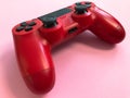 Beautiful red digital modern new game joystick for computer video games gamepad on a pink background Royalty Free Stock Photo