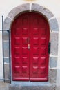 Beautiful red door with stone entryway steel gate Royalty Free Stock Photo