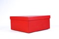 Beautiful red gift box with closed lid with side view and space for text on white background