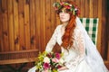 Beautiful red hair bride with flowers Royalty Free Stock Photo