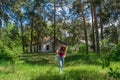 Beautiful red hair woman lost at the abandoned summer camp