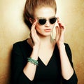 Beautiful red-haired fashion model in retro sunglasses Royalty Free Stock Photo