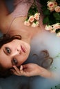 beautiful red-haired girl with beautiful . Natural beauty, natural hair color. Ginger, in a milk bath Royalty Free Stock Photo