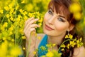 Beautiful girl in blue dress with yellow flowers Royalty Free Stock Photo