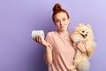 Beautiful red-haired girl doesn`t have problems with pets