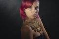 Beautiful red-haired young woman wearing a royal jewelry necklac